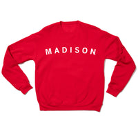 Red crew neck sweatshirt with "Madison" printed in white ink.