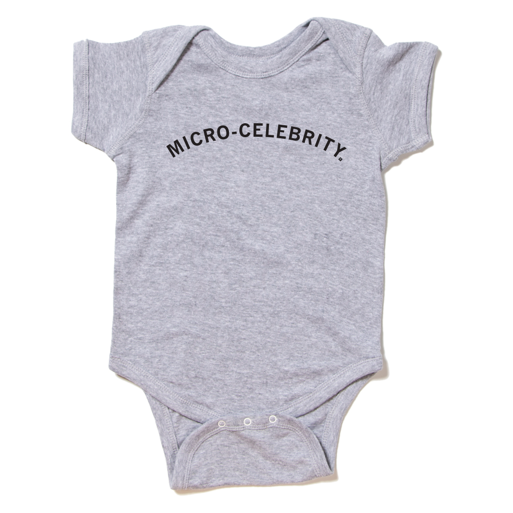 Gray baby Micro-Celebrity onesie with the words printed on the chest.