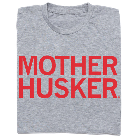 Heather gray t-shirt with the text MOTHER HUSKER printed in red capital letters.