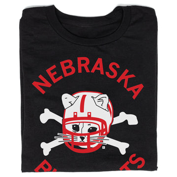 Union-made black T-shirt featuring a graphic of a cat wearing a football helmet over crossed bones, with NEBRASKA printed in red above it.