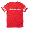 Vintage Nebraska red t-shirt with white stripes on the sleeves and the word NEBRASKA printed in white across the chest.