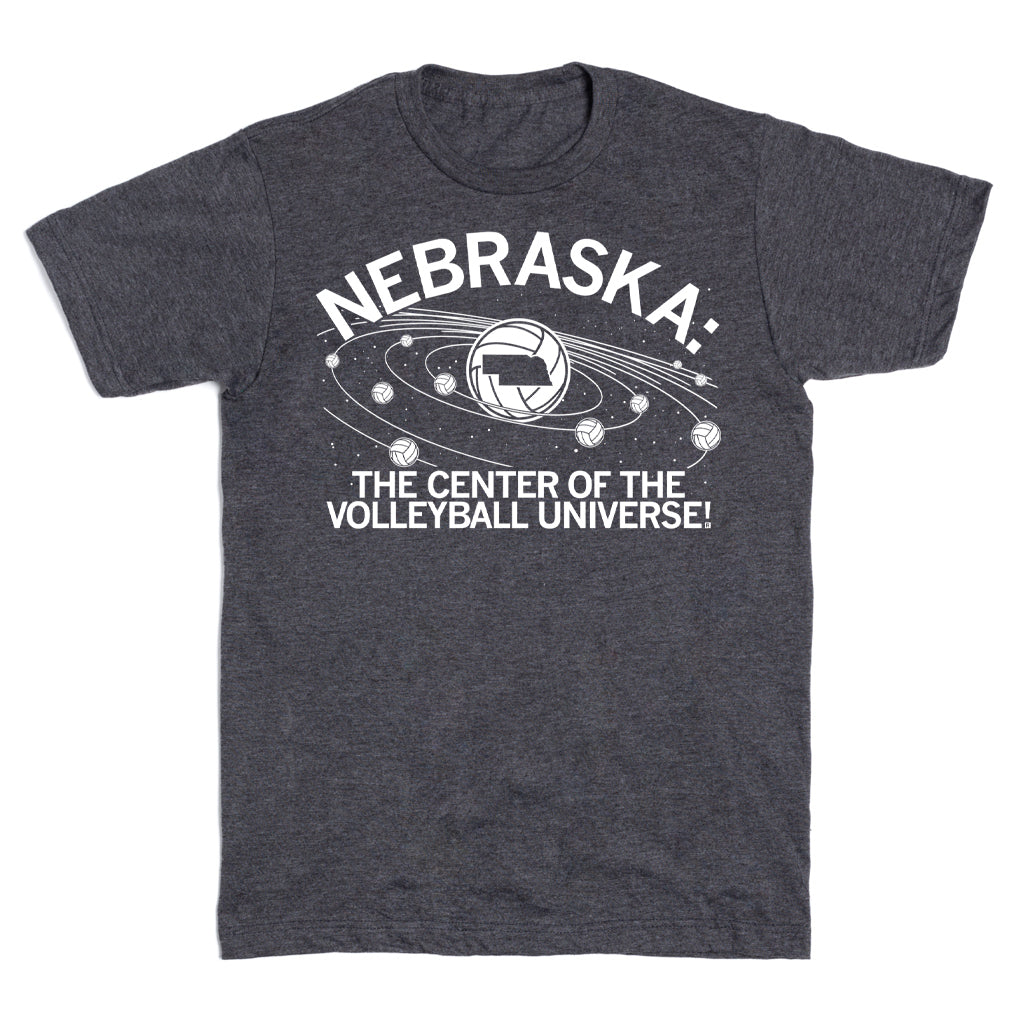 Charcoal Nebraska volleyball t-shirt featuring a graphic of the state inside a volleyball surrounded by orbiting balls, with text reading: NEBRASKA: THE CENTER OF THE VOLLEYBALL UNIVERSE!.