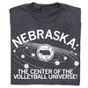 Charcoal T-shirt featuring a volleyball graphic with the state of Nebraska at the center of planetary rings, surrounded by smaller volleyballs and the text NEBRASKA: THE CENTER OF THE VOLLEYBALL UNIVERSE!.
