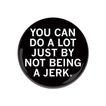 Black circular RAYGUN pin button with the white text, YOU CAN DO A LOT JUST BY NOT BEING A JERK.