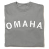 Folded gray heavyweight crewneck sweatshirt with the word OMAHA printed in white arching across the chest.