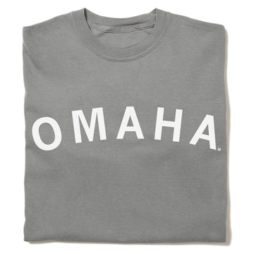 Folded gray heavyweight crewneck sweatshirt with the word OMAHA printed in white arching across the chest.