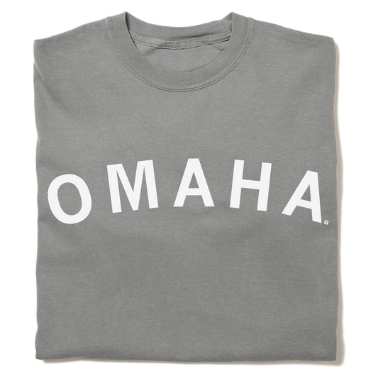 Folded gray heavyweight crewneck sweatshirt with the word OMAHA printed in white arching across the chest.