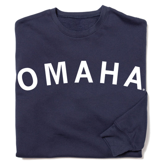 Navy blue crewneck sweatshirt by RAYGUN with OMAHA printed in white capital letters across the chest.