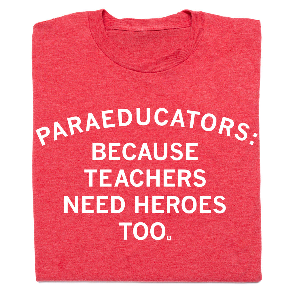 Heather red crewneck t-shirt featuring the white text: PARAEDUCATORS: BECAUSE TEACHERS NEED HEROES TOO.