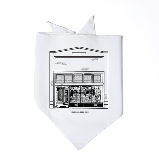 White Paul’s Book Store bandana featuring a black line drawing of the storefront with the text MADISON 1954-2025 printed below.