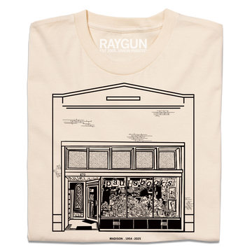 Heavyweight ivory t-shirt featuring a black line drawing of the Paul’s Book Store storefront with the text MADISON . 1954 - 2025 below.