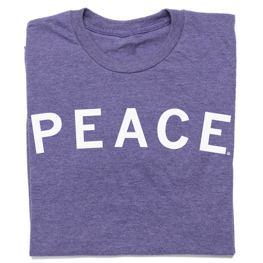 Folded heather purple t-shirt with the word PEACE printed in white capital letters.