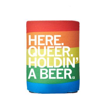 Rainbow-colored RAYGUN foam drink sleeve with white text that reads, HERE. QUEER. HOLDIN A BEER.