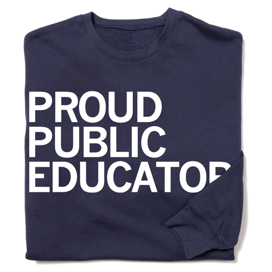 Navy blue RAYGUN sweatshirt featuring the text PROUD PUBLIC EDUCATOR printed in large white capital letters.