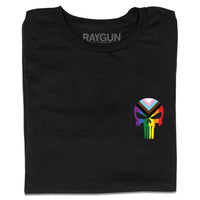 A folded black t-shirt with a heat transfer print of the punisher logo as a progress pride flag printed where a chest pocket would be.