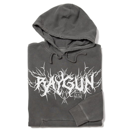 Pigment black RAYGUN pullover hoodie in dark grey, featuring a white jagged, metal-style logo and a small cat graphic on the chest.