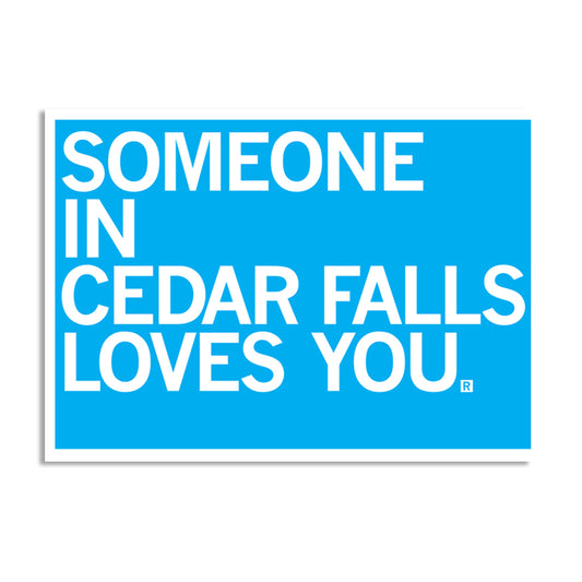 A bright blue RAYGUN postcard with white text that reads, SOMEONE IN CEDAR FALLS LOVES YOU.