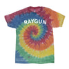 Short-sleeved rainbow tie-dye t-shirt with a spiral pattern in red, yellow, green, and blue, featuring the word RAYGUN printed in white across the chest.