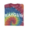 Folded rainbow tie-dyed t-shirt with RAYGUN printed in white letters.