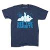 Heather denim t-shirt featuring a graphic of four white rabbits in front of a Cedar Rapids skyline outline with the text SEE THE RABBITS in light blue.
