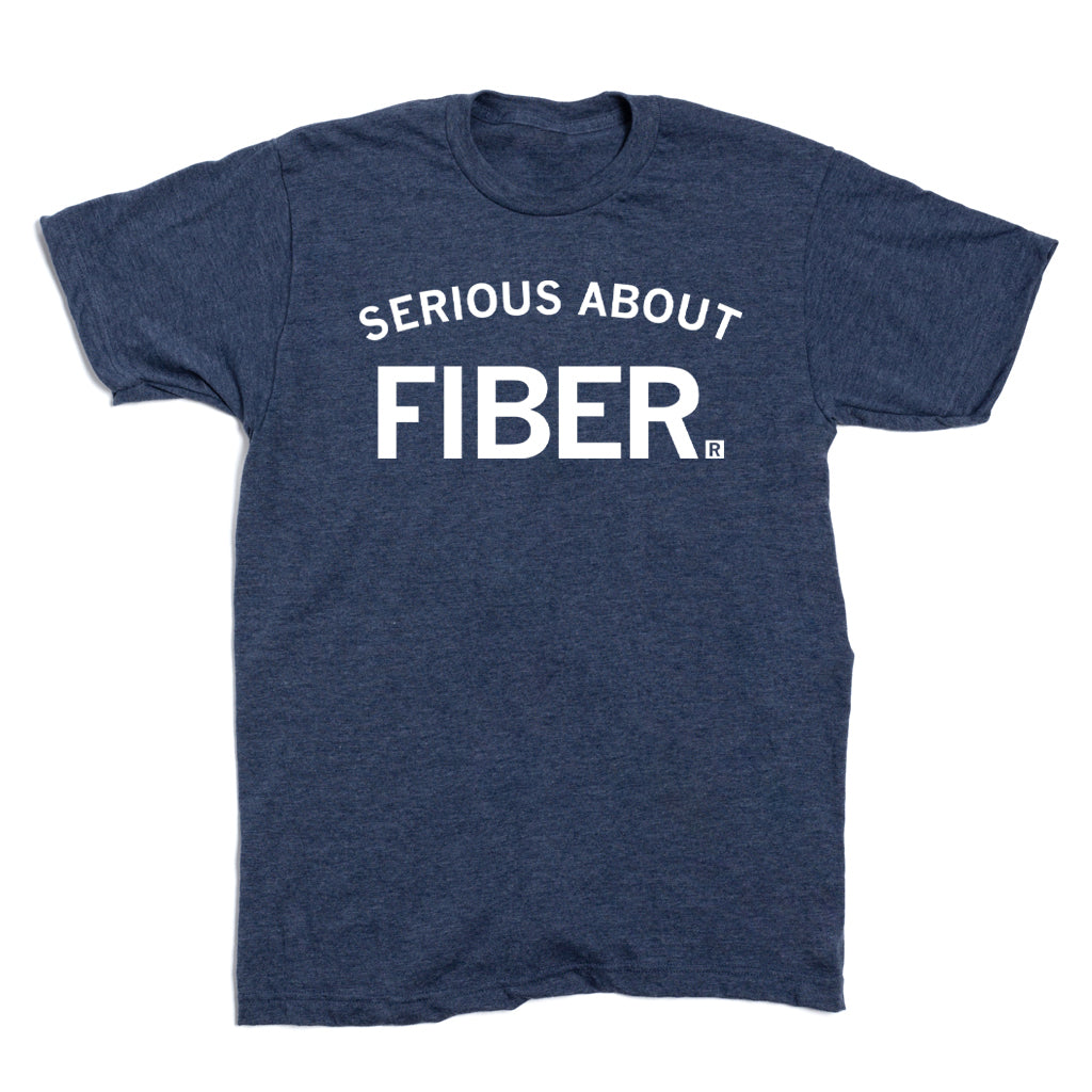 Heather denim blue t-shirt with the words SERIOUS ABOUT FIBER printed in white lettering.