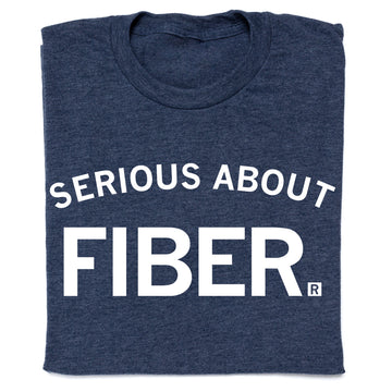 A heather denim crewneck t-shirt in dark blue with the text SERIOUS ABOUT FIBER. printed in white.