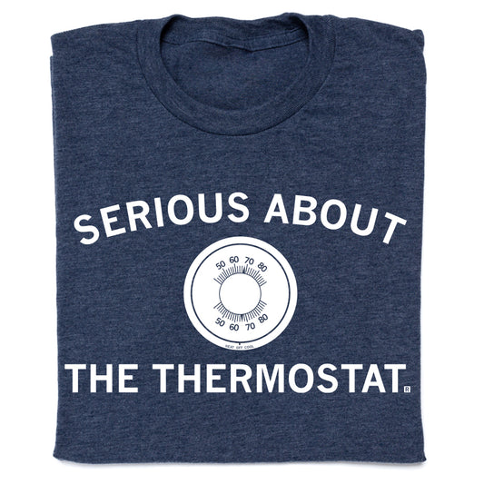 Heather denim navy blue t-shirt featuring a circular thermostat dial graphic in the center with the text SERIOUS ABOUT THE THERMOSTAT.