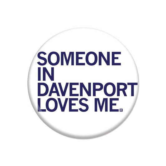 A white RAYGUN metal button with the blue text SOMEON IN DAVENPORT LOVES ME.