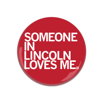 Round red RAYGUN button with white text that reads, SOMEONE IN LINCOLN LOVES ME.