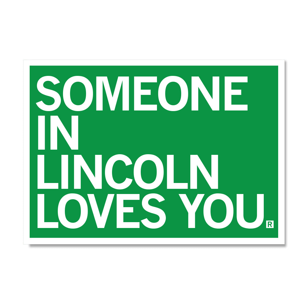 A green RAYGUN sign with white text that reads, SOMEONE IN LINCOLN LOVES YOU.
