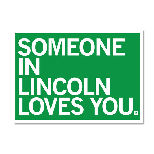 A green RAYGUN sign with white text that reads, SOMEONE IN LINCOLN LOVES YOU.