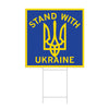 A blue Stand With Ukraine yard sign with a yellow border featuring the Ukrainian coat of arms trident symbol.