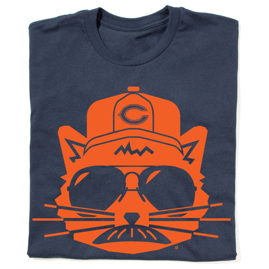 Navy blue RAYGUN t-shirt featuring an orange graphic of a cat wearing a Chicago Bears baseball cap and sunglasses.