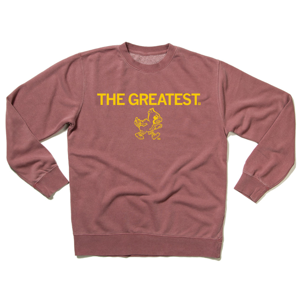 Dusty rose RAYGUN crewneck sweatshirt with the text THE GREATEST in yellow letters above a gold screen print graphic of a yellow cardinal.