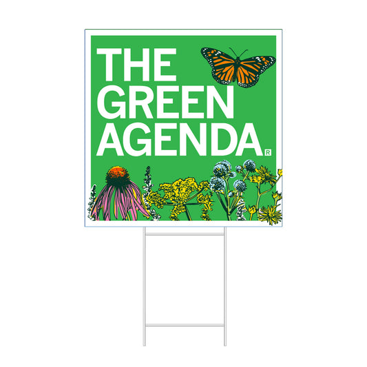 A RAYGUN lawn sign on a metal frame that reads THE GREEN AGENDA with illustrations of a monarch butterfly and various wildflowers.