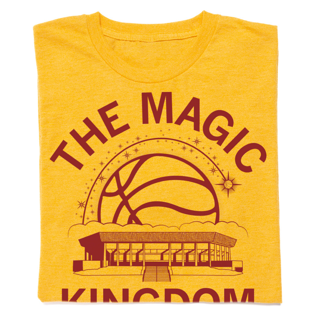 Gold union made t-shirt with a maroon graphic featuring a basketball, a building, and the text THE MAGIC KINGDOM.