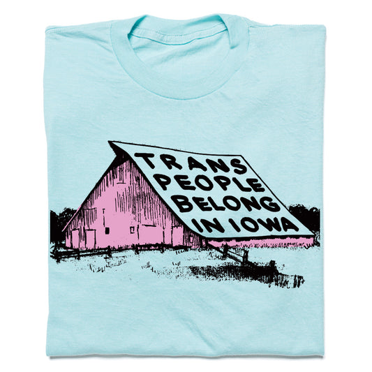 Light blue, union made t-shirt featuring a screen-printed graphic of a pink barn with the text TRANS PEOPLE BELONG IN IOWA on the roof.