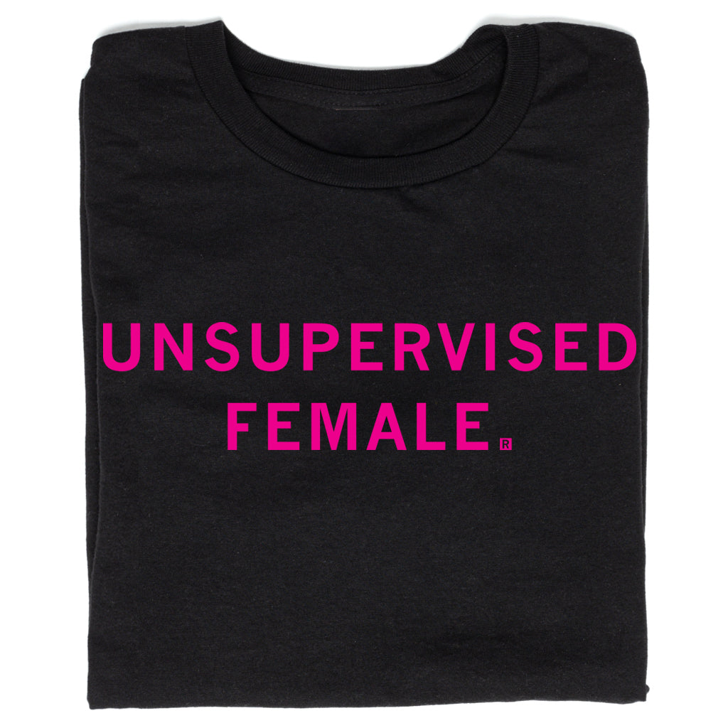 Black union-made t-shirt featuring the text UNSUPERVISED FEMALE printed in bright Rhodamine Red.