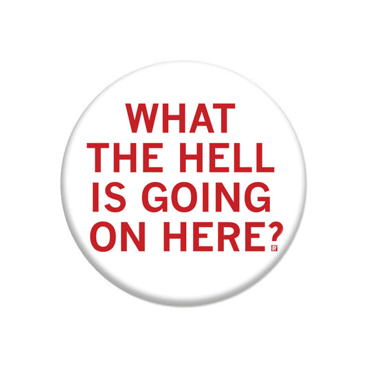 Round RAYGUN button pin with a white background and red text reading: WHAT THE HELL IS GOING ON HERE?.