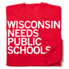 Red crewneck RAYGUN sweatshirt with white text reading WISCONSIN NEEDS PUBLIC SCHOOLS to support public education.