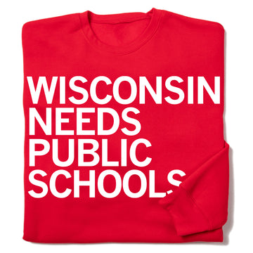 Red crewneck RAYGUN sweatshirt with white text reading WISCONSIN NEEDS PUBLIC SCHOOLS to support public education.