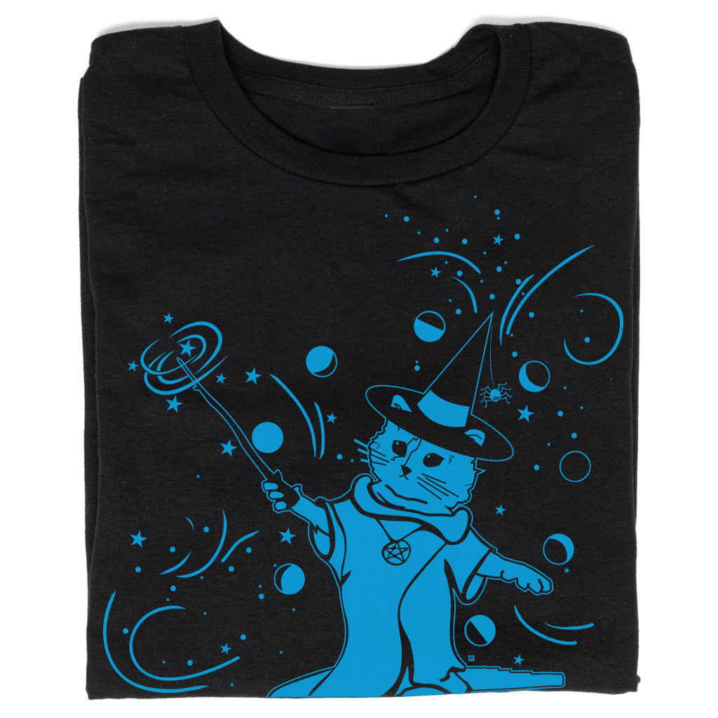 Black union-made t-shirt featuring a blue wizard screen print of a cat wearing a witch hat and robe, holding a wand amidst stars and orbs.