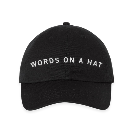 Black RAYGUN baseball cap with the words WORDS ON A HAT embroidered in white text across the front.