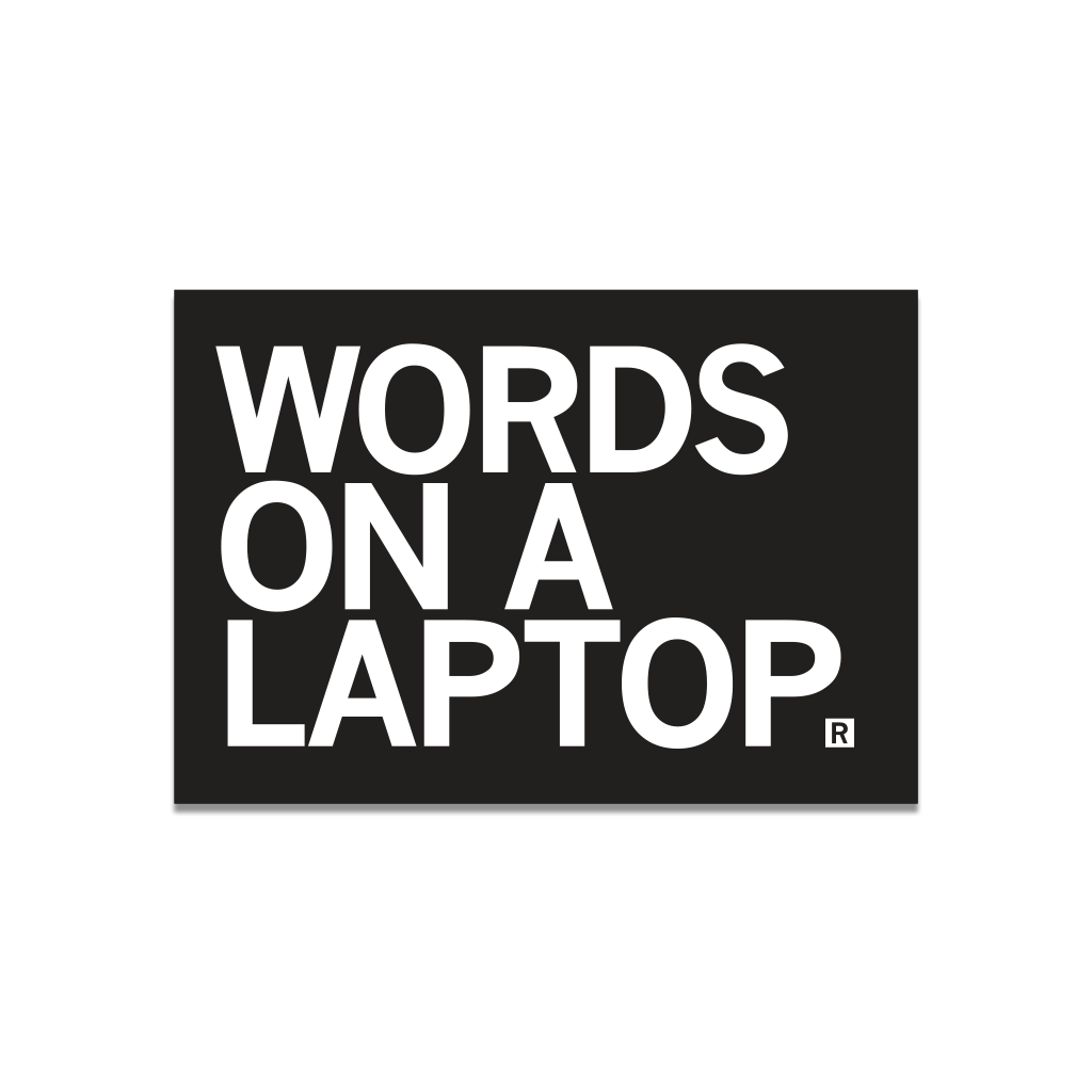 A black rectangular RAYGUN die-cut vinyl sticker featuring the white text WORDS ON A LAPTOP with a registered trademark symbol.