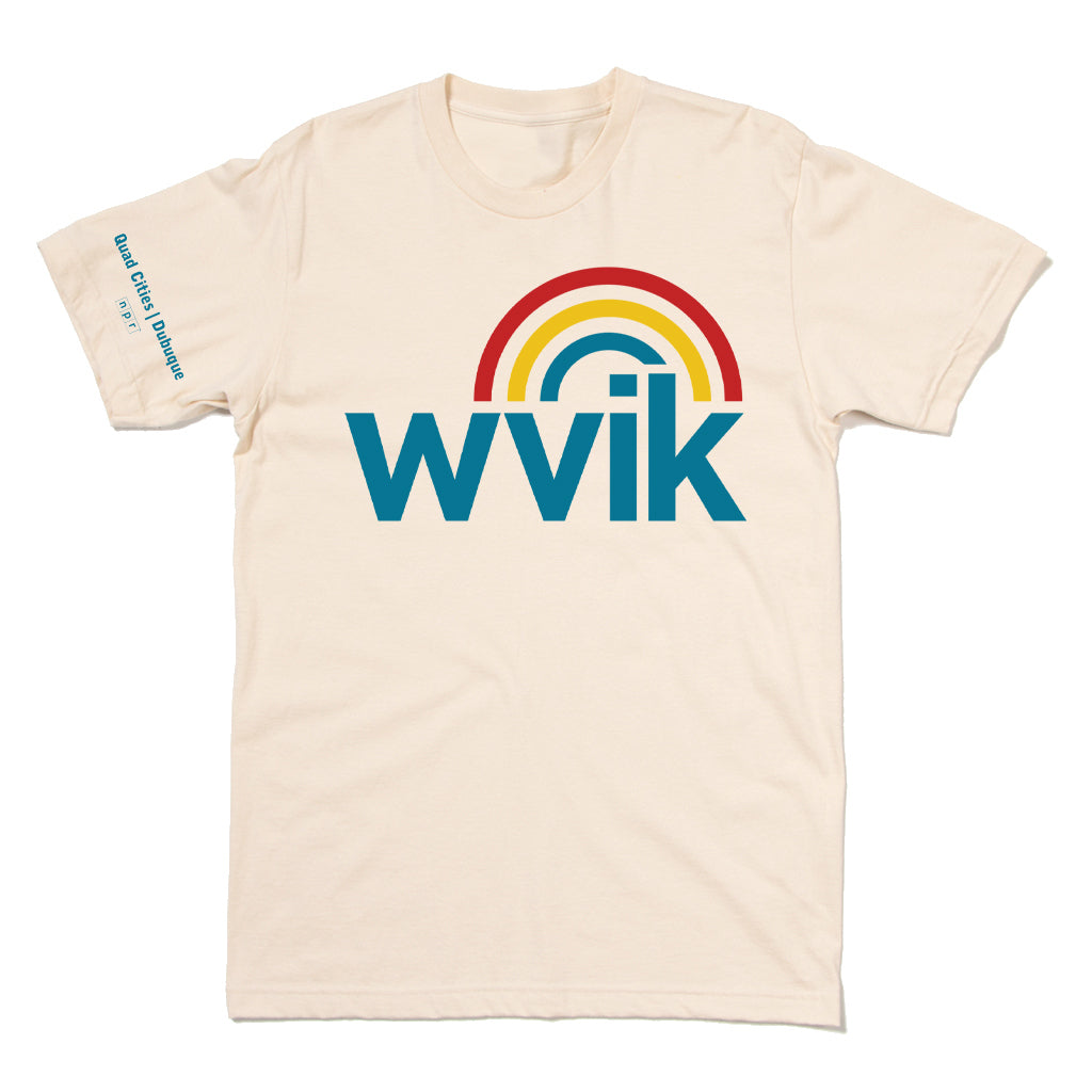 Cream-colored WVIK vintage logo t-shirt featuring a blue logo topped with a red, yellow, and blue rainbow arch, with Quad Cities | Dubuque npr printed on the right sleeve.