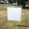 A 12-inch by 12-inch blank Chloroplast yard sign supported by a wire stake in a grass lawn.