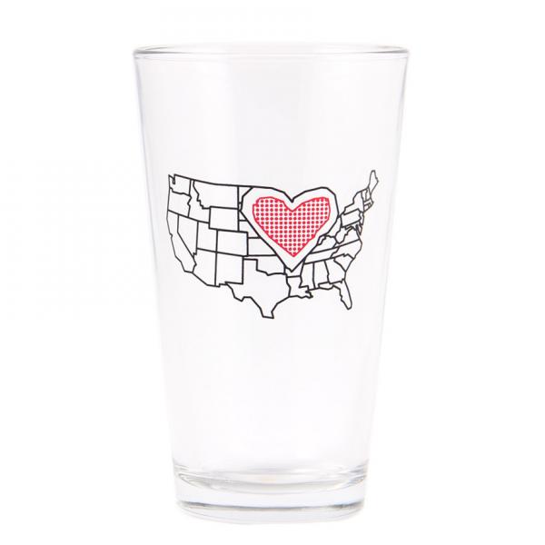 Clear, dishwasher-safe drinking glass featuring an outline of the United States with a red heart icon placed over the center of the country.