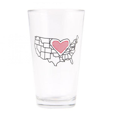 Clear, dishwasher-safe drinking glass featuring an outline of the United States with a red heart icon placed over the center of the country.