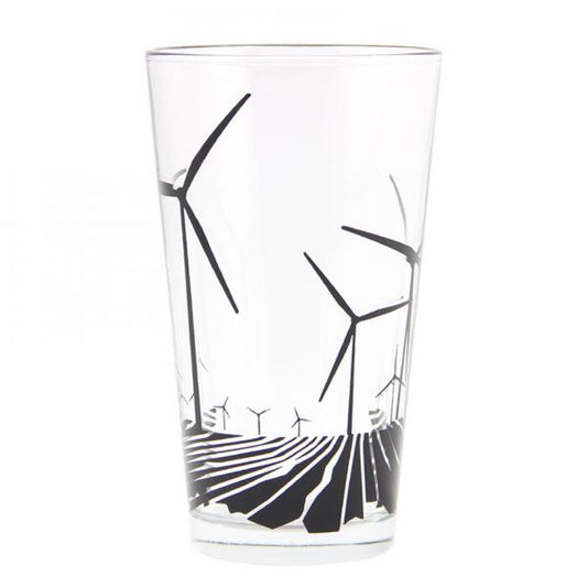 A dishwasher-safe glass pint tumbler decorated with a black graphic of wind turbines over a field.