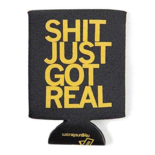 Black scuba foam drink koozie with the text SHIT JUST GOT REAL printed in large yellow gold plastisol ink letters.